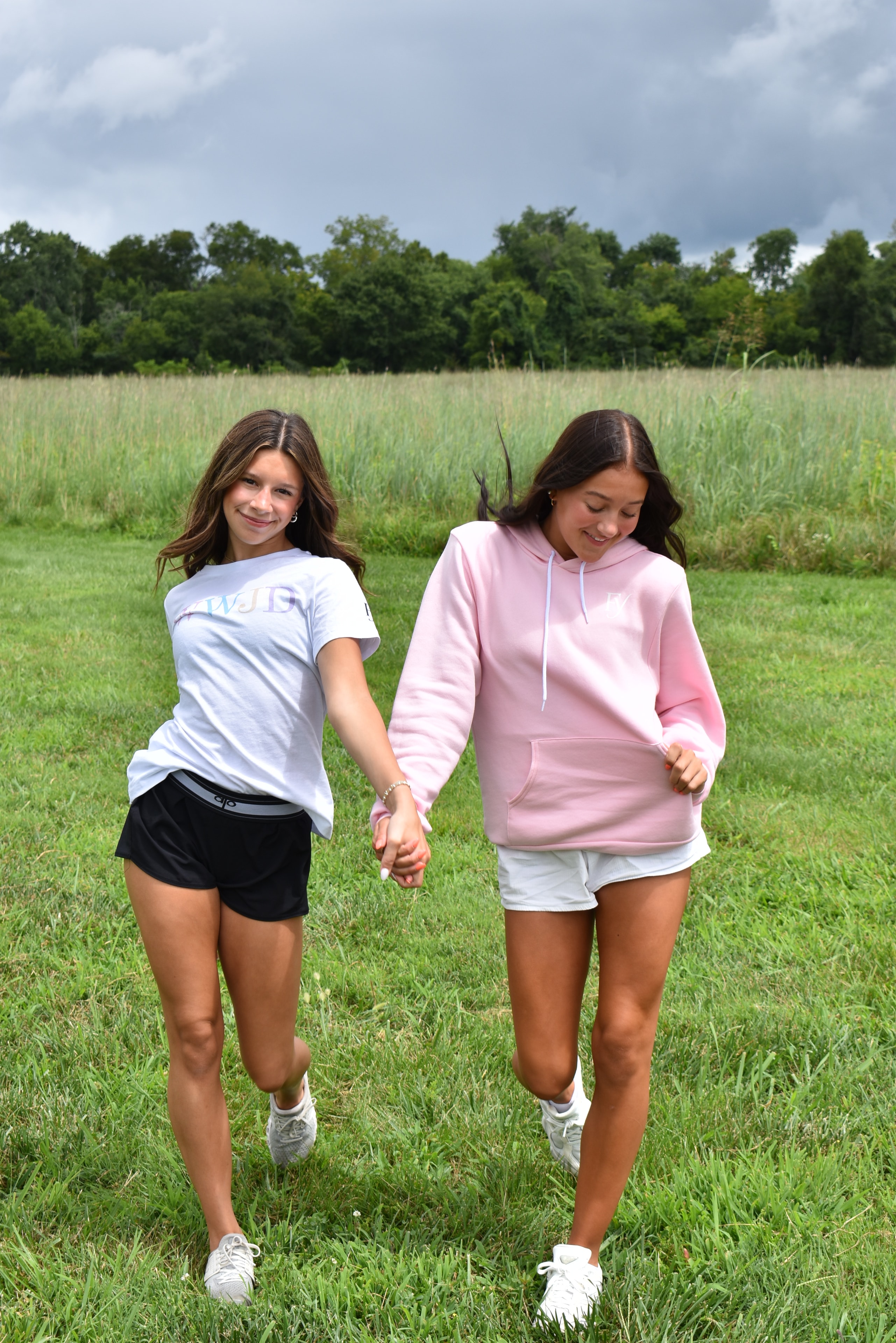 Two girls relaxing on a grass blanket